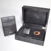 open Omega Speedmaster Limited Edition display case showing black leather interior with white stitching, removable watch cushion, Apollo-Soyuz mission patch and separate Omega wallet; inside lid reads “OMEGA Speedmaster LIMITED EDITION”